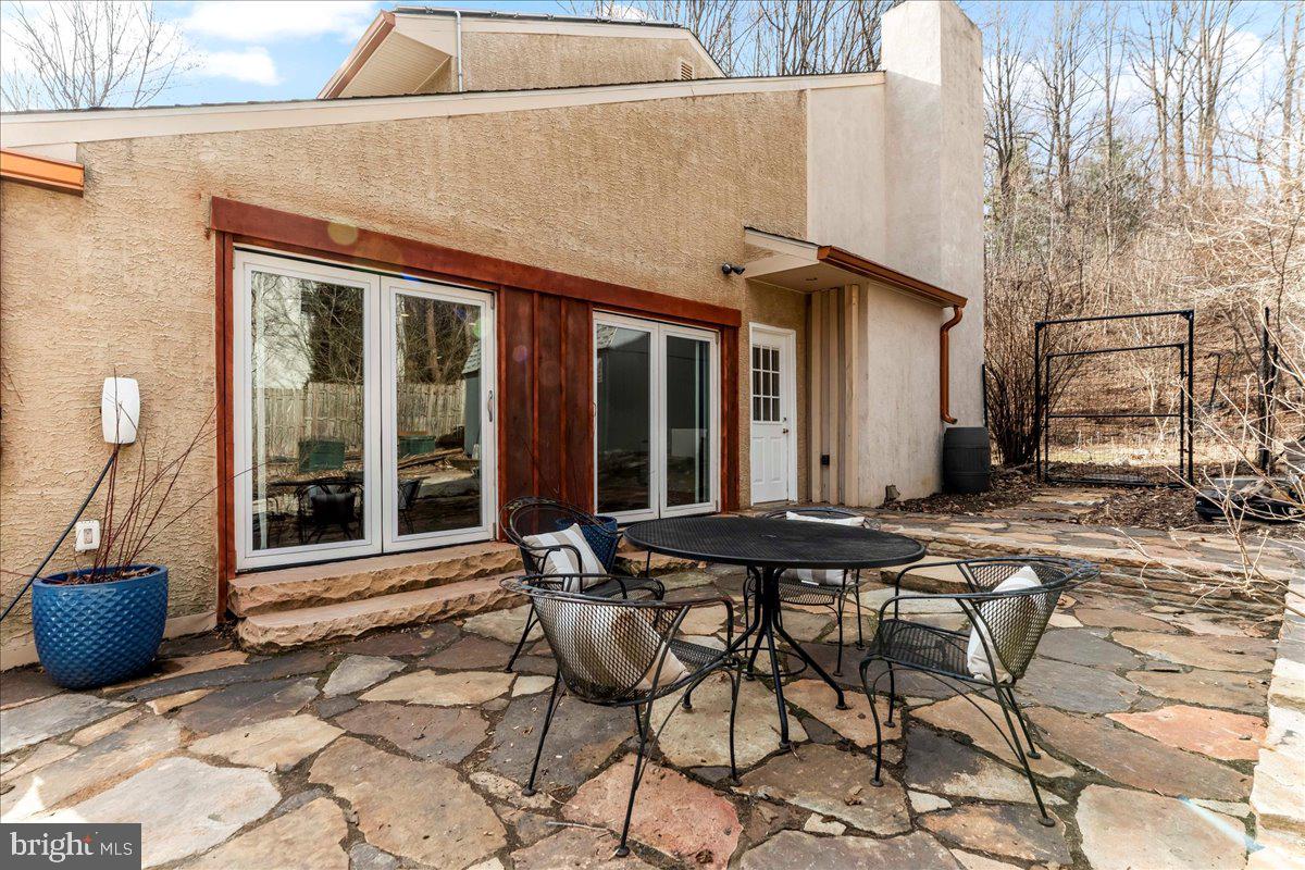 716 South Roberts Road Bryn Mawr, PA 19010 - Photo 34 of 39 a view of a patio with table and chairs and potted plants