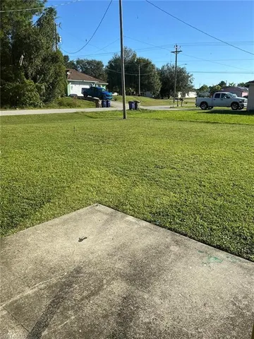a view of a field with ocean view