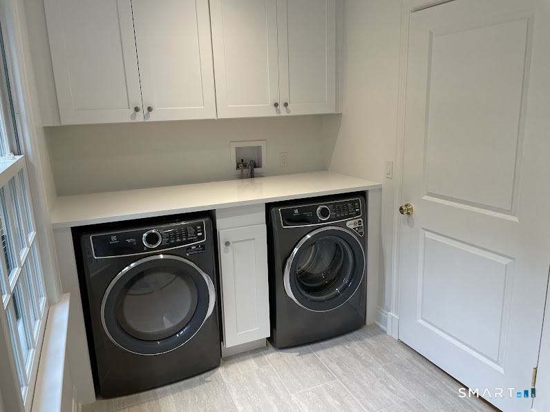9 Tory Hole Road Darien, CT 06820 - Photo 26 of 33 a utility room with sink dryer and washer