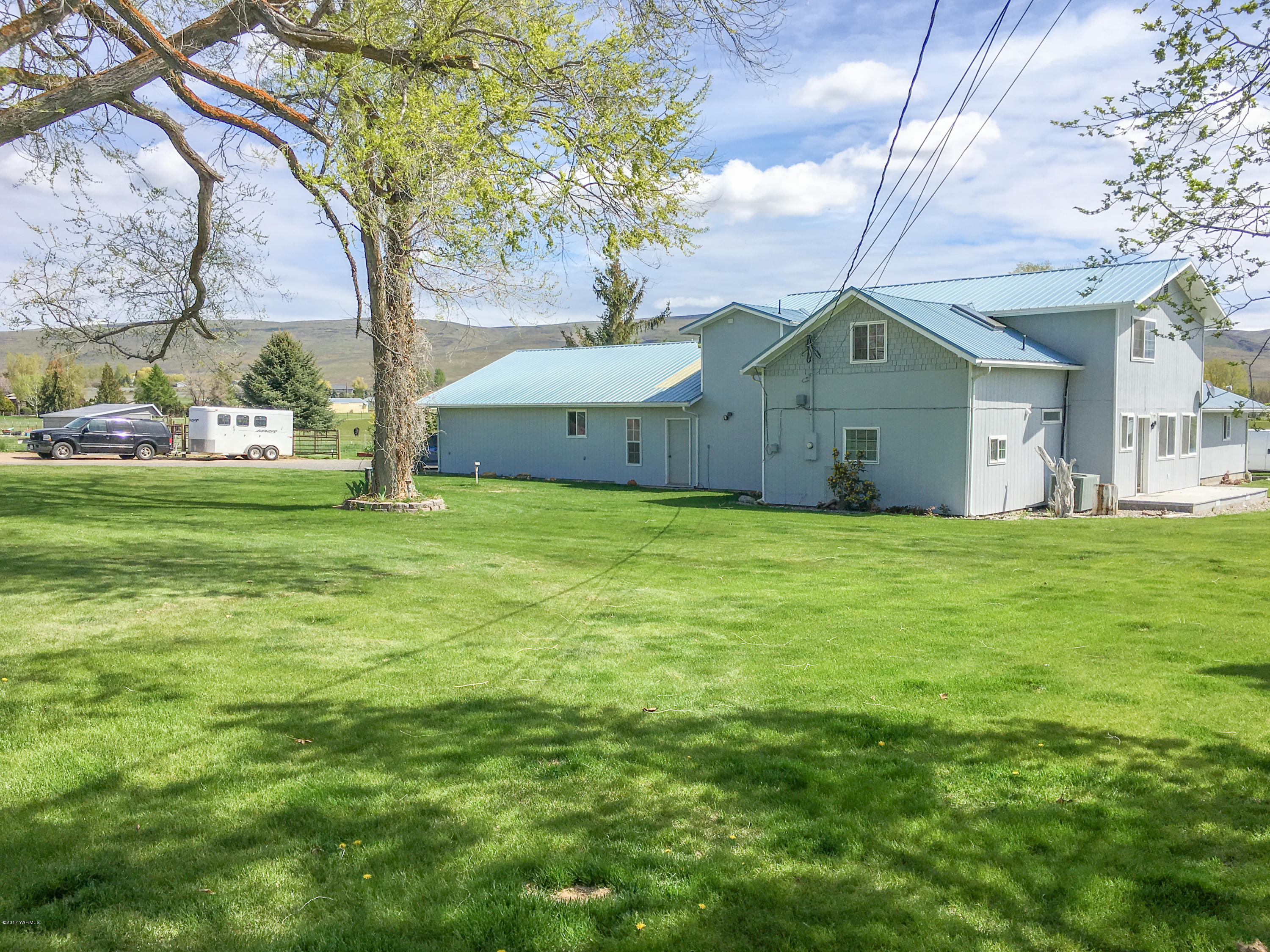 331 Sheep Company Road Selah, WA 98942 - Photo 3 of 40 a view of a house with a yard