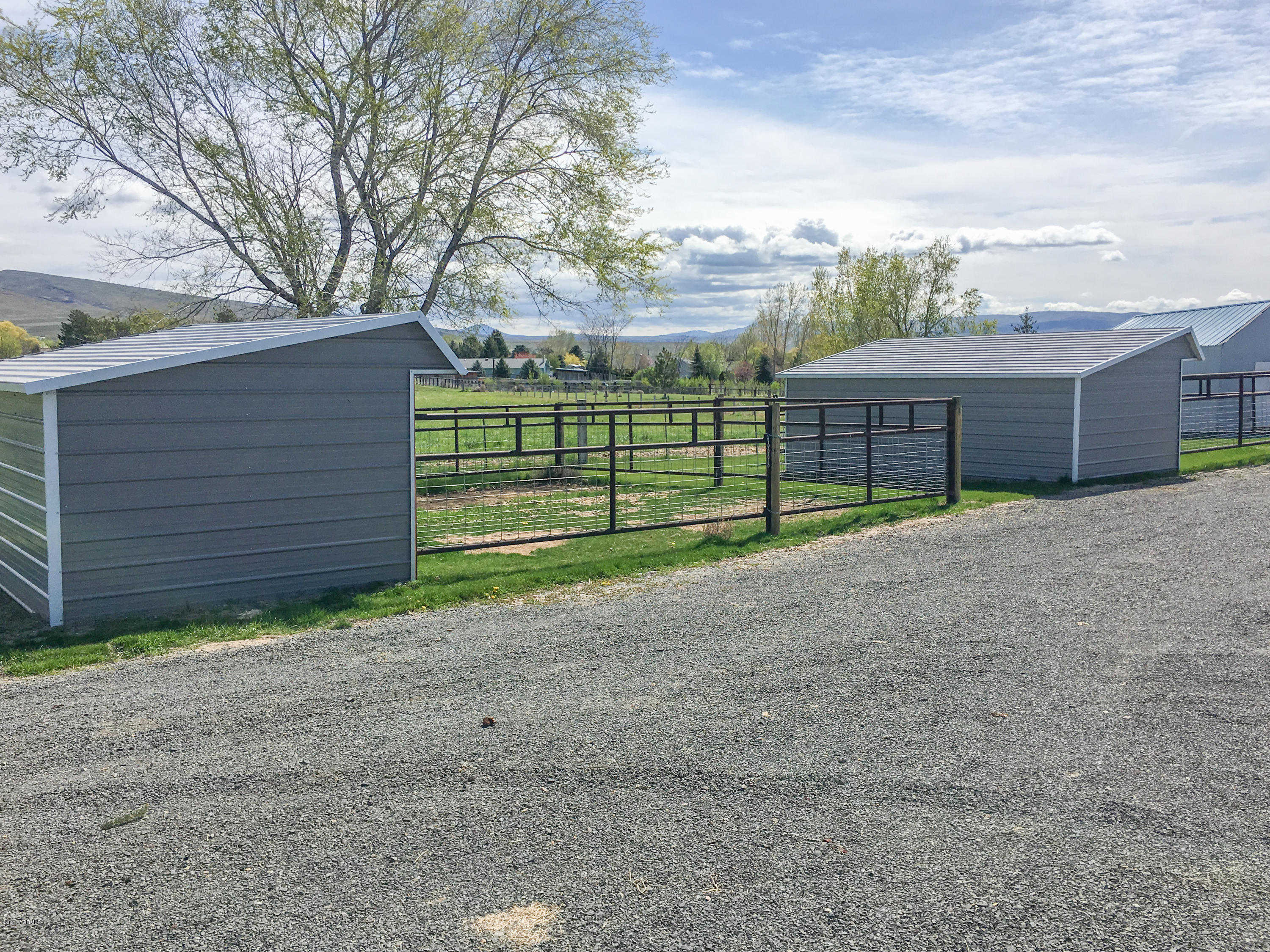 331 Sheep Company Road Selah, WA 98942 - Photo 30 of 40 a view of a house with a backyard