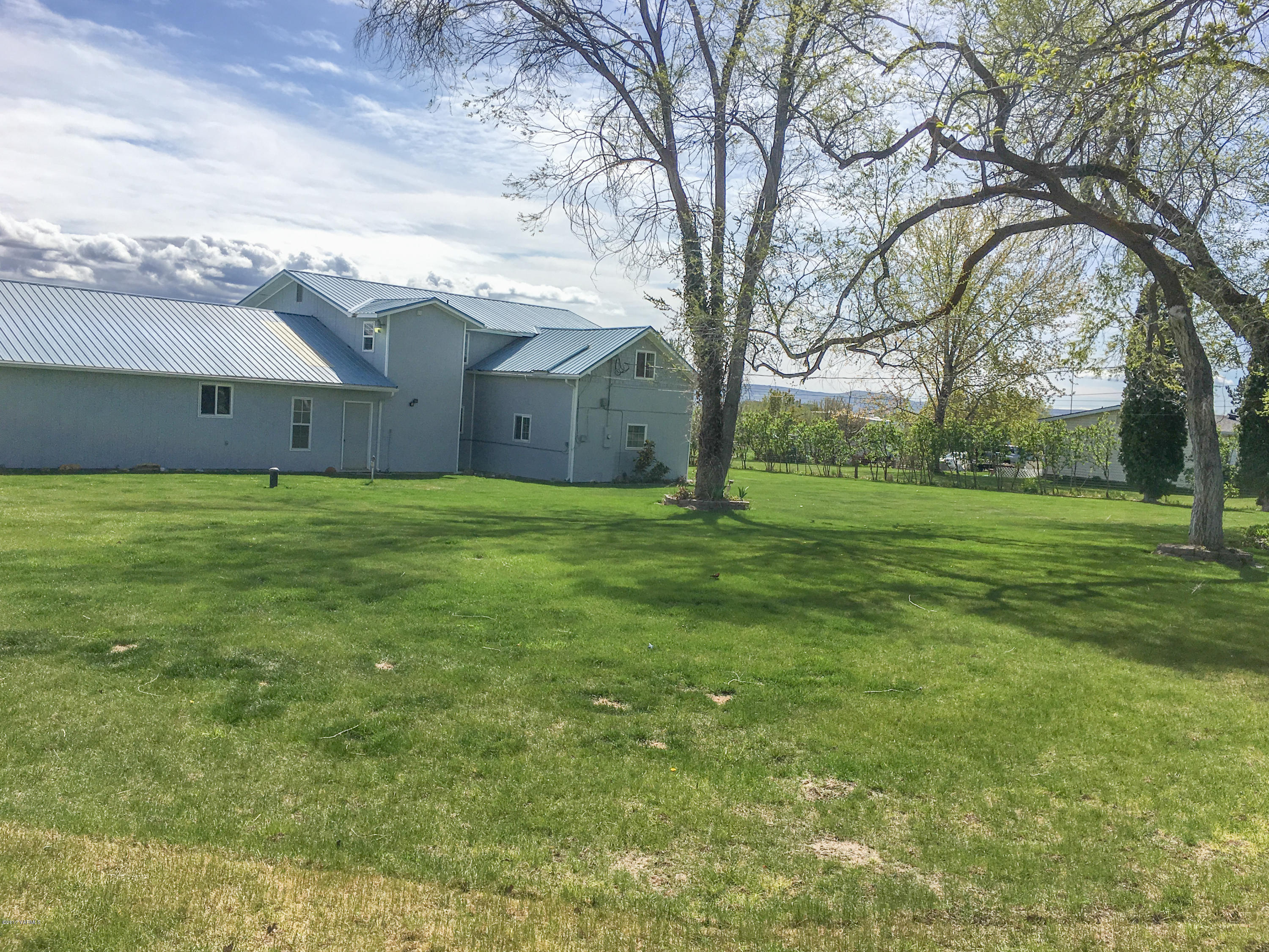 331 Sheep Company Road Selah, WA 98942 - Photo 38 of 40 a view of a house with a yard