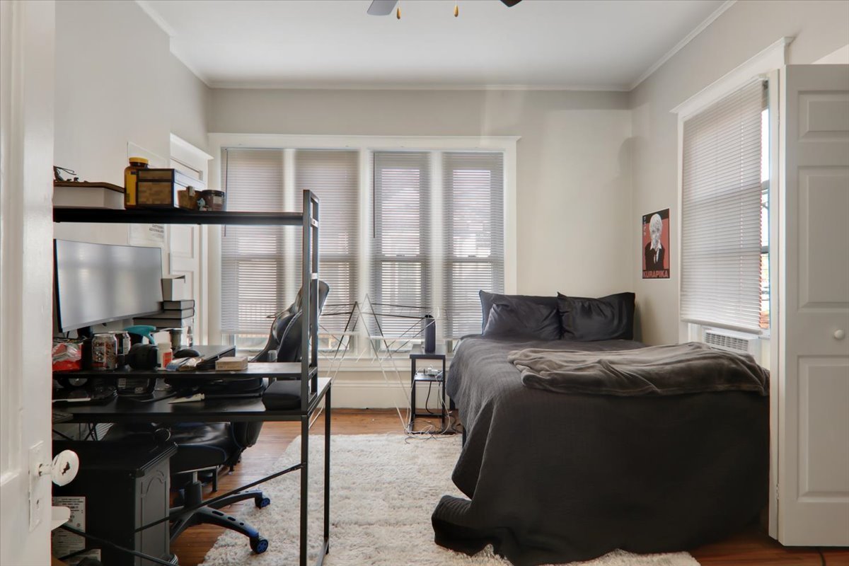 910 North Center Street Bloomington, IL 61701 - Photo 12 of 26 a bedroom with furniture and a window