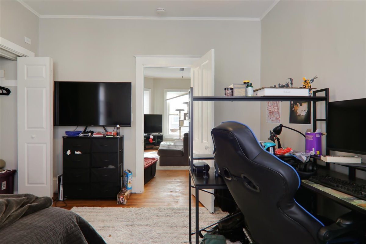 910 North Center Street Bloomington, IL 61701 - Photo 13 of 26 a living room with furniture and a flat screen tv