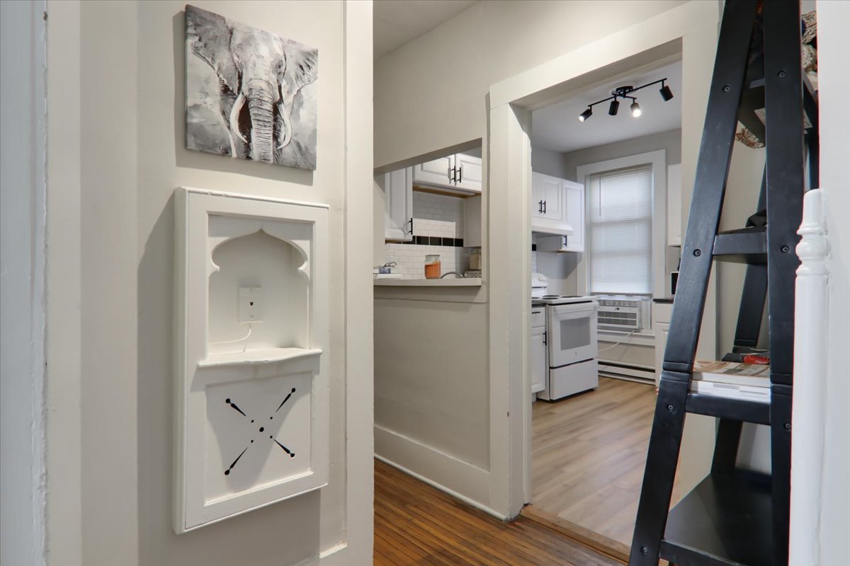 910 North Center Street Bloomington, IL 61701 - Photo 18 of 26 a view of a hallway to rooms and wooden floor