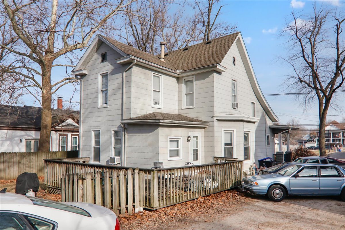 910 North Center Street Bloomington, IL 61701 - Photo 4 of 26 a view of a car park in front of a house