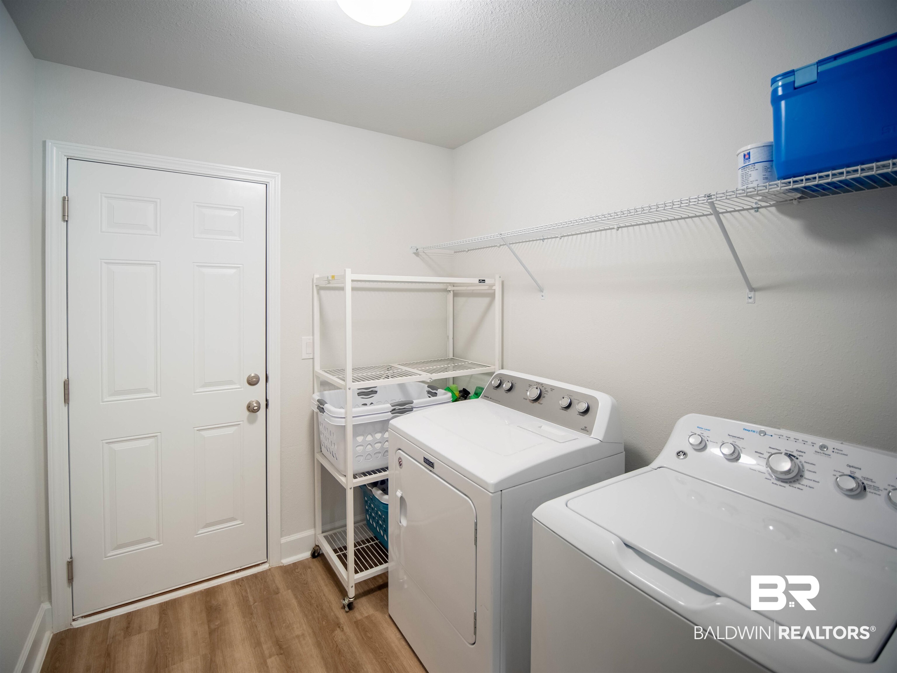 12646 Michigan Avenue Elberta, AL 36530 - Photo 33 of 47 Laundry room featuring washer and clothes dryer and light wood-style floors