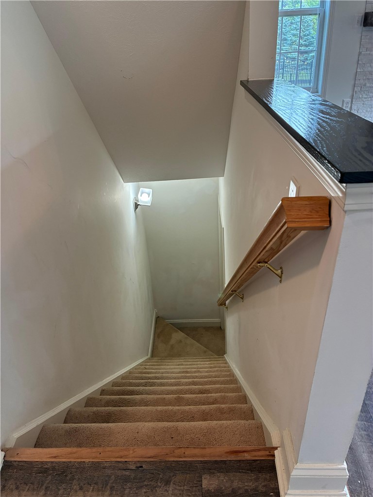 18 Dona Lea Road Perinton, NY 14450 - Photo 26 of 29 The open stairwell to the basement piques the imagination for expansion opportunities.