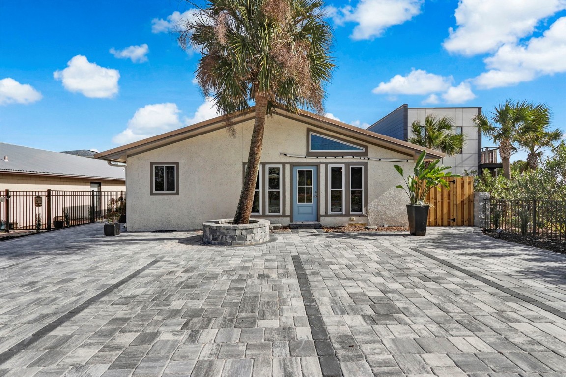 338 Tarpon Avenue Fernandina Beach, FL 32034 - Photo 2 of 36 a front view of a house with a patio