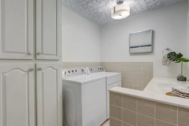 a bedroom with furniture and a chandelier