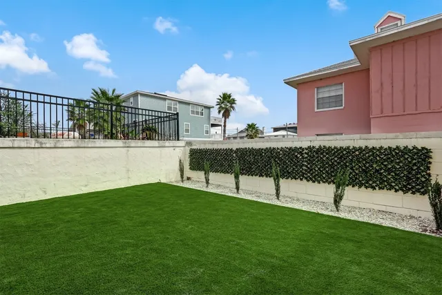 a view of a chairs in backyard of house