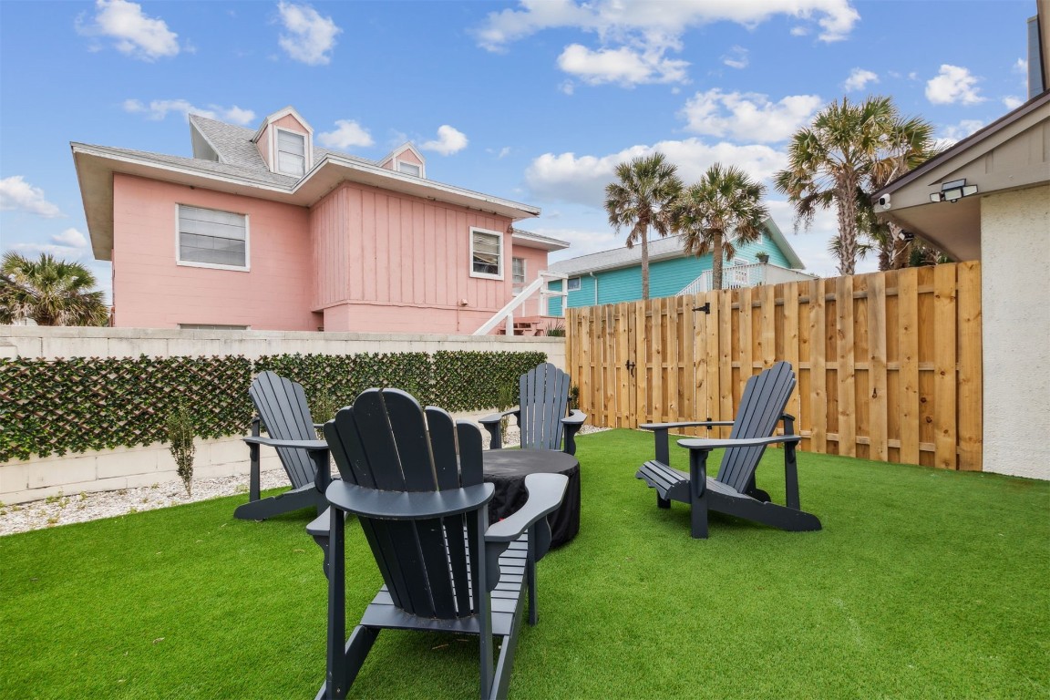 338 Tarpon Avenue Fernandina Beach, FL 32034 - Photo 31 of 36 a view of a chairs in backyard of house