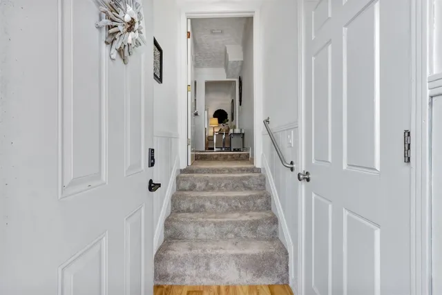 a bedroom with furniture and a flat screen tv