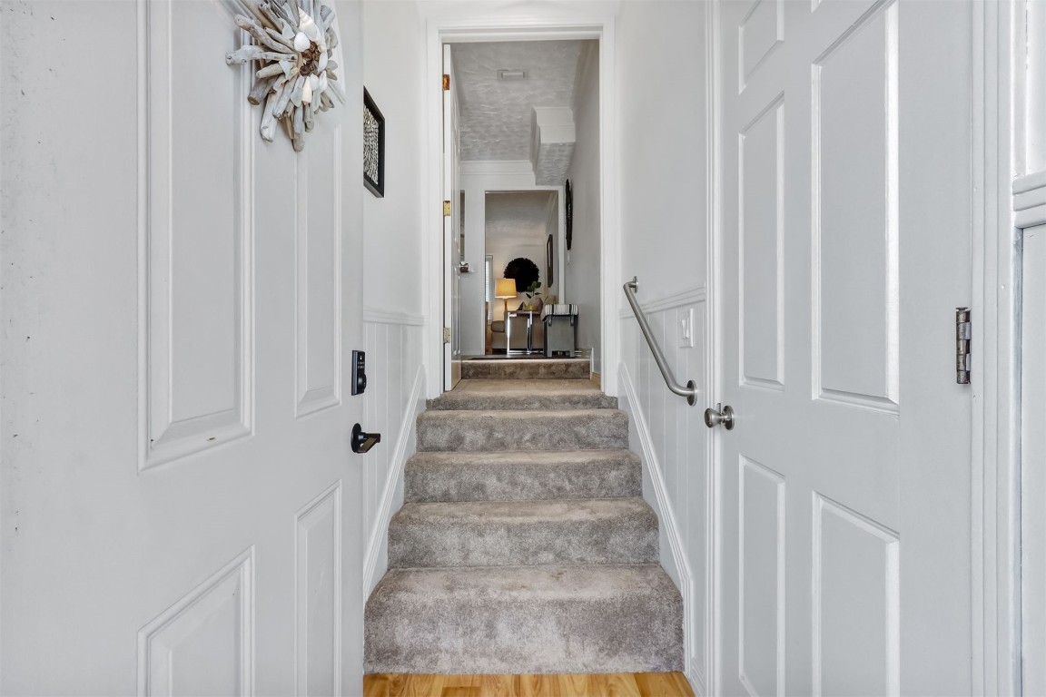 338 Tarpon Avenue Fernandina Beach, FL 32034 - Photo 4 of 36 a view of a hallway with a white door and stairs