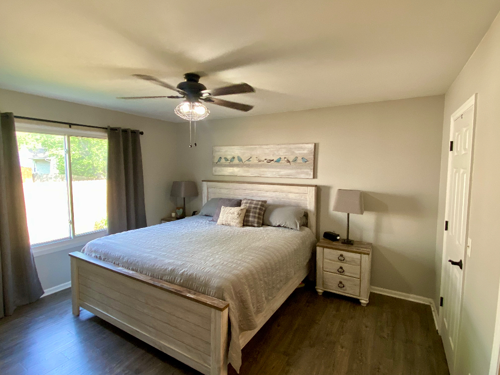 26 Winrock Road Montgomery, IL 60538 - Photo 11 of 24 a bedroom with a bed and a chandelier