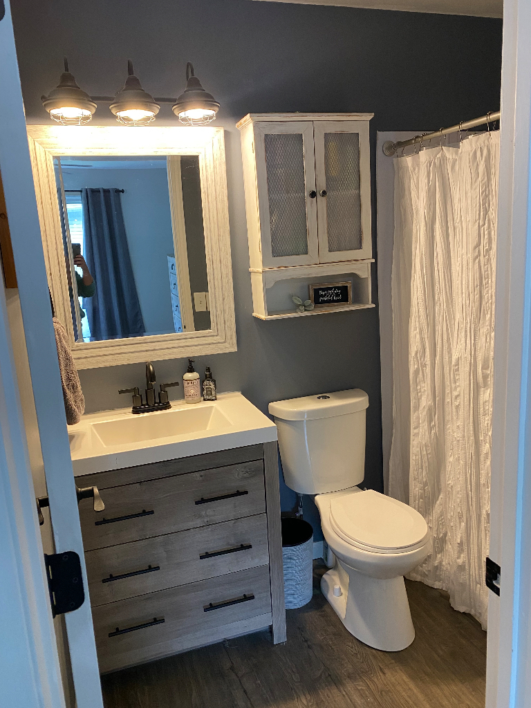 26 Winrock Road Montgomery, IL 60538 - Photo 13 of 24 a bathroom with a toilet a sink and mirror