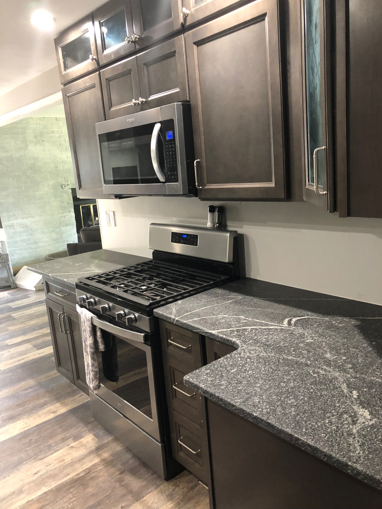 26 Winrock Road Montgomery, IL 60538 - Photo 9 of 24 a kitchen with a stove and a microwave