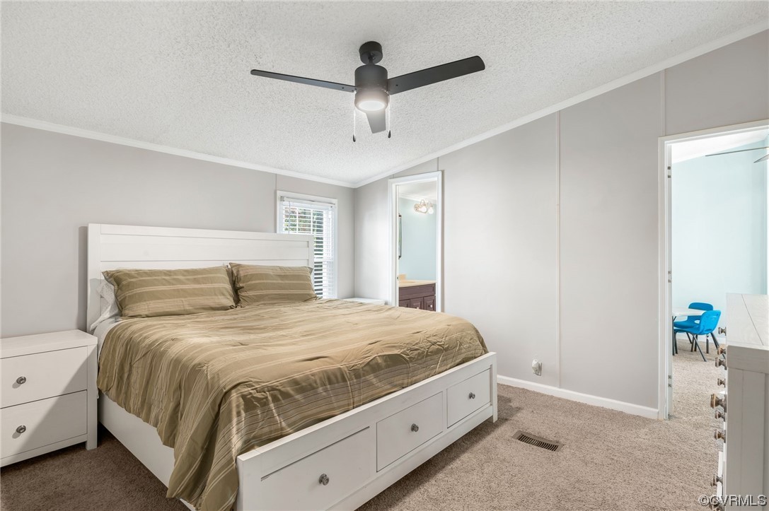 2382 Pony Farm Road Maidens, VA 23102 - Photo 15 of 34 a bedroom with a bed and a chandelier