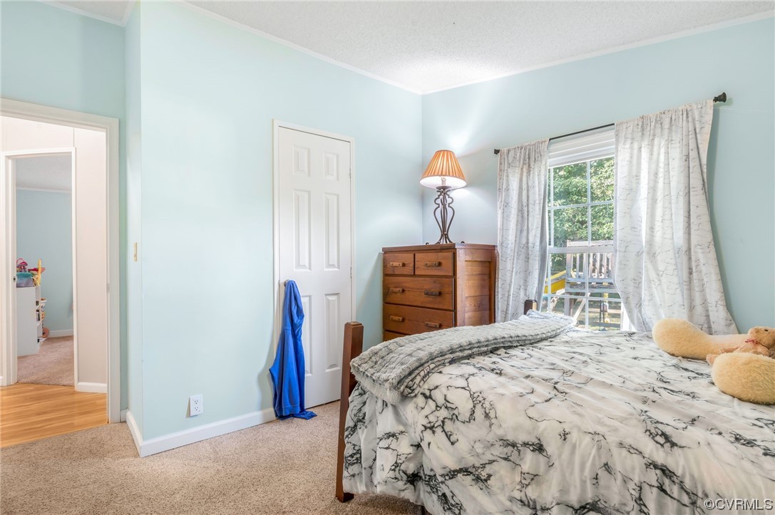 2382 Pony Farm Road Maidens, VA 23102 - Photo 21 of 34 a bedroom with a large bed and a window