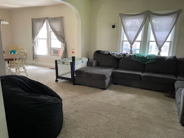 a kitchen with a sink and large window