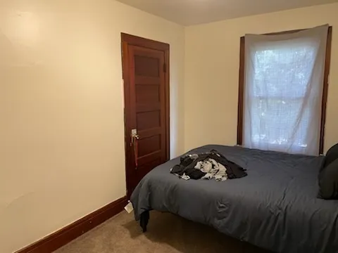 a white toilet sitting next to a bath tub