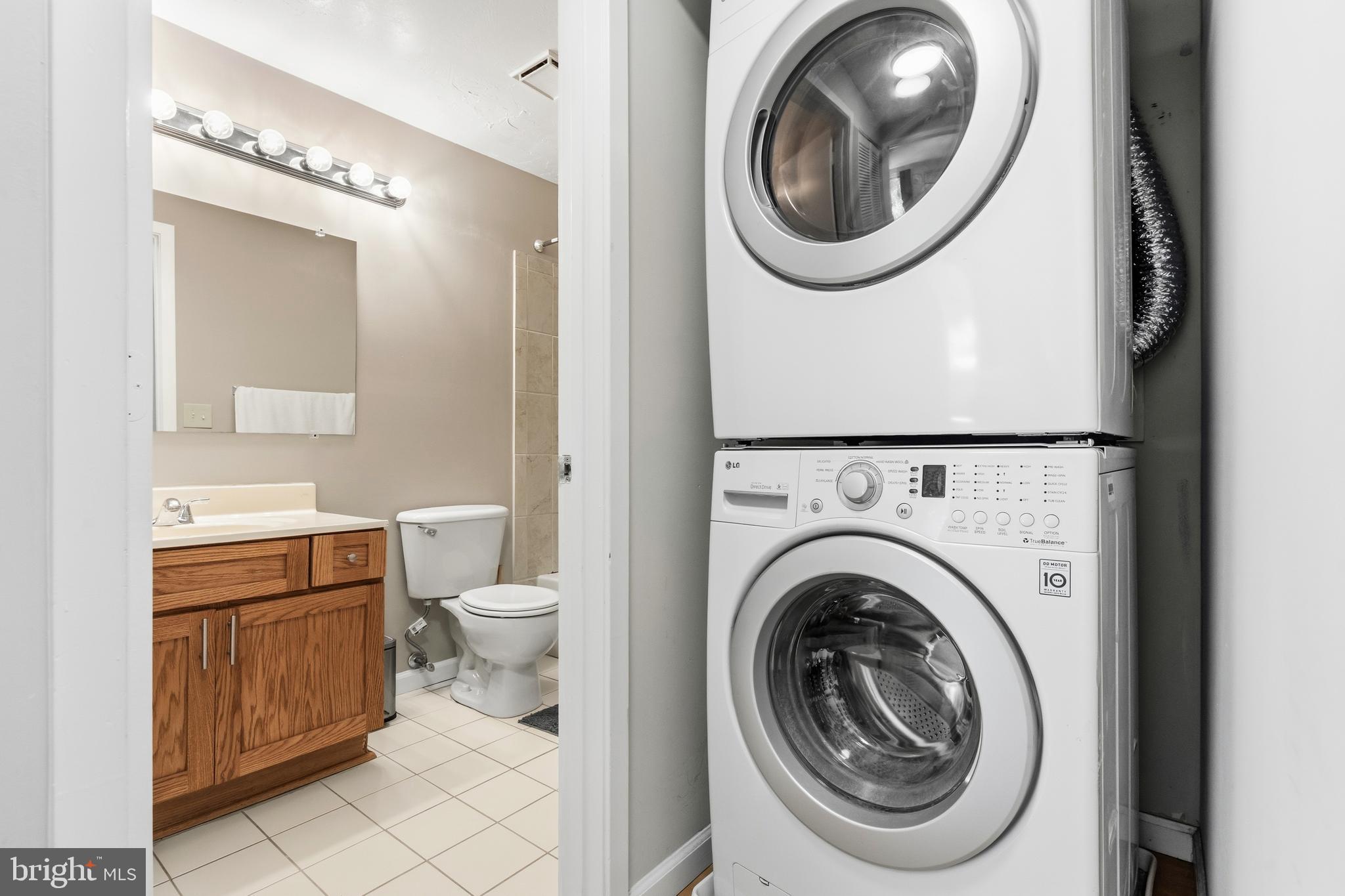11705 Summerchase Circle Reston, VA 20194 - Photo 24 of 25 Laundry with stackable washer and dryer