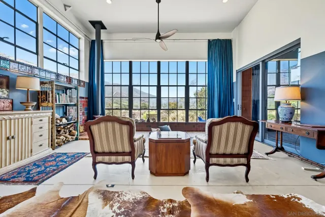 a living room with furniture and a table