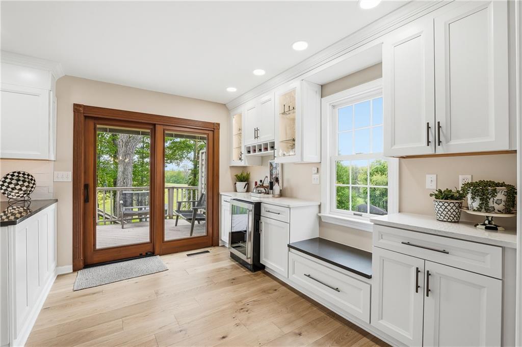 267 Forsythe Road Mars, PA 16046 - Photo 13 of 41 a open kitchen with white cabinets and a window