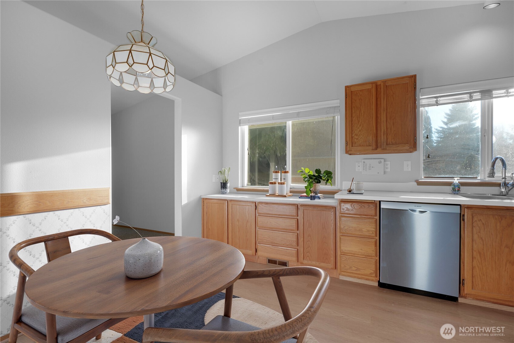 24005 72nd Avenue East Graham, WA 98338 - Photo 12 of 32 a kitchen with a table chairs and cabinets