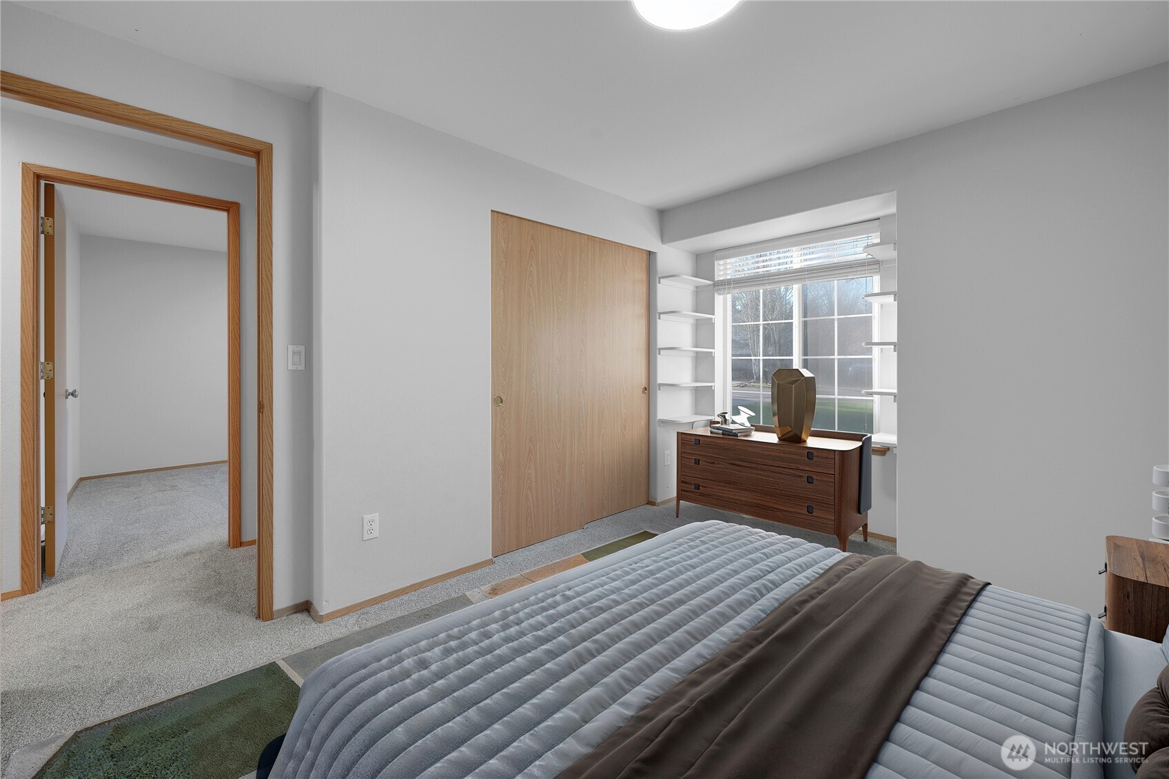 24005 72nd Avenue East Graham, WA 98338 - Photo 17 of 32 a bedroom with a bed and wooden floor