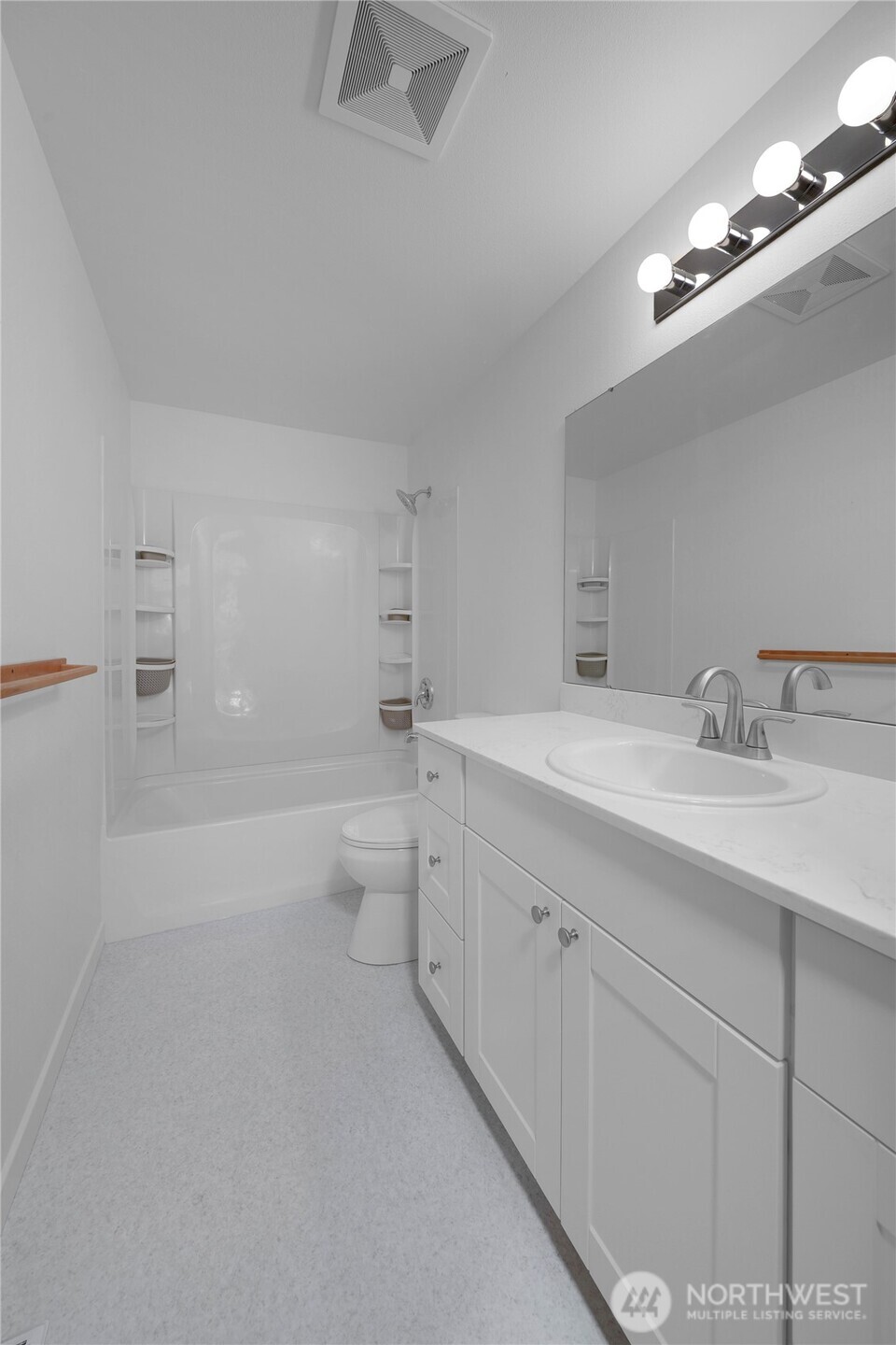 24005 72nd Avenue East Graham, WA 98338 - Photo 18 of 32 a bathroom with a double vanity sink toilet and shower