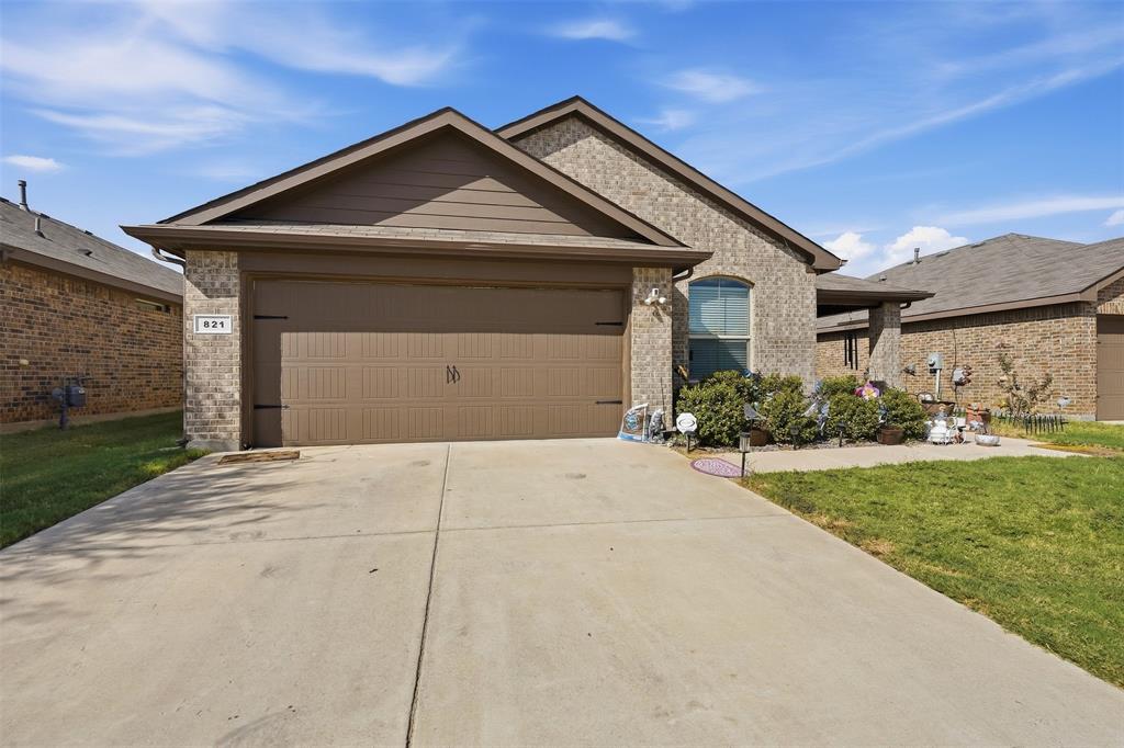 821 Rutherford Drive Crowley, TX 76036 - Photo 1 of 28 Front of home with 2 car garage