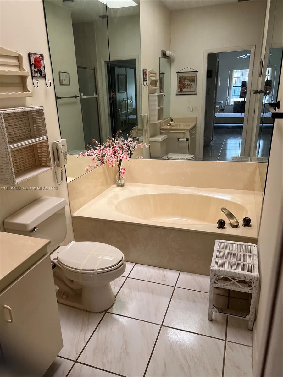 Aberdeen Boynton Beach, FL 33472 - Photo 12 of 19 a bathroom with a sink and a mirror