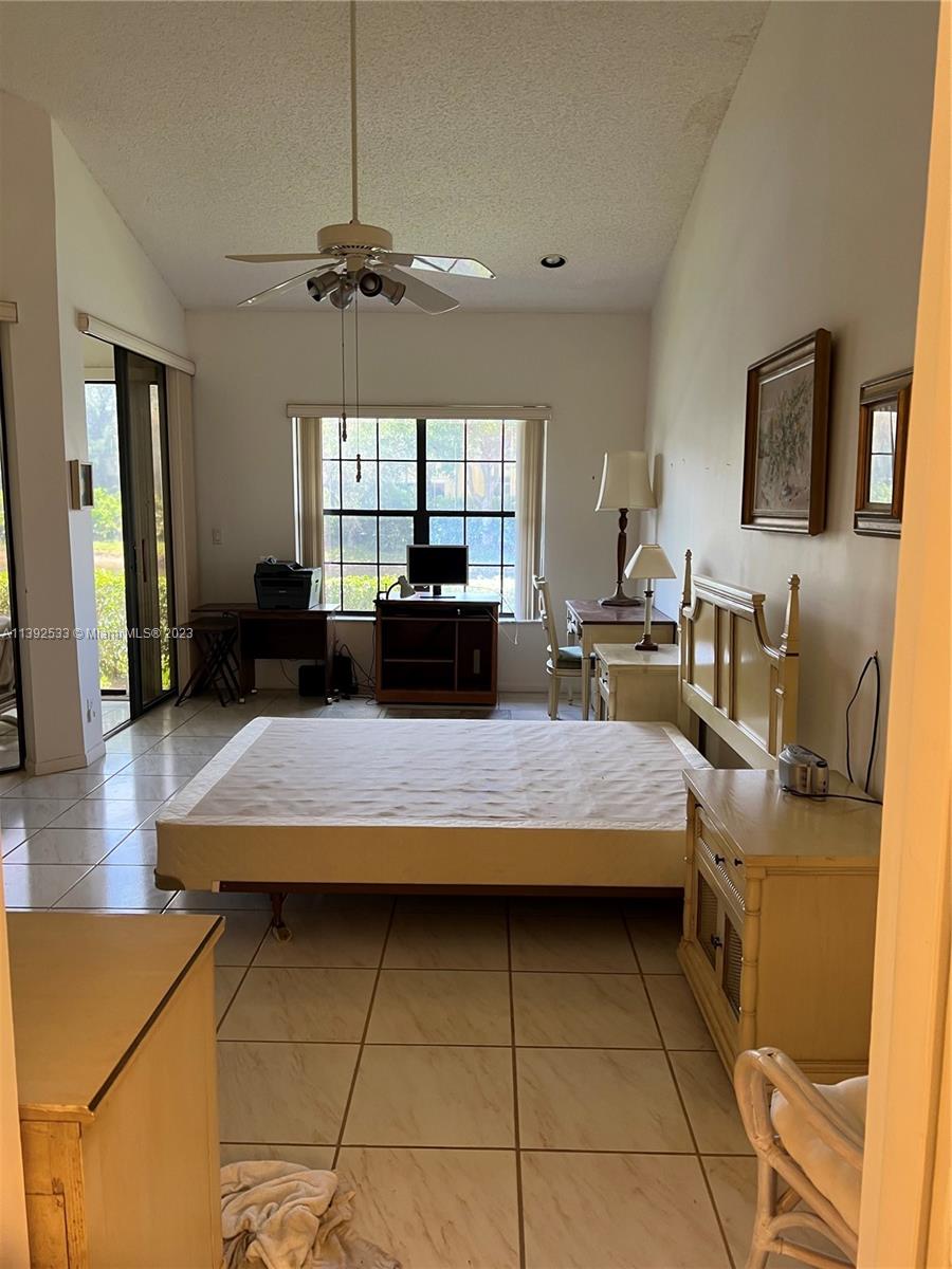 Aberdeen Boynton Beach, FL 33472 - Photo 17 of 19 a living room with furniture and a flat screen tv