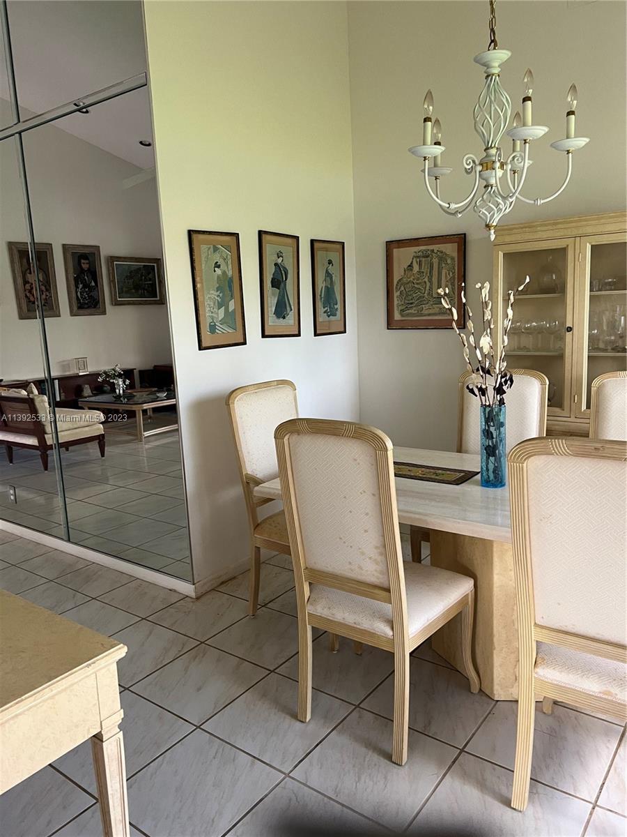Aberdeen Boynton Beach, FL 33472 - Photo 6 of 19 a dining room with wooden floor and chandelier