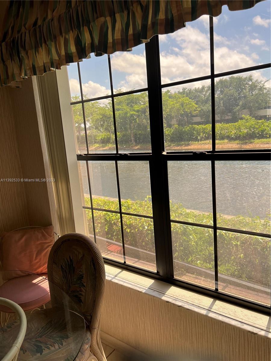 Aberdeen Boynton Beach, FL 33472 - Photo 7 of 19 a living room with a large window and floor to ceiling window
