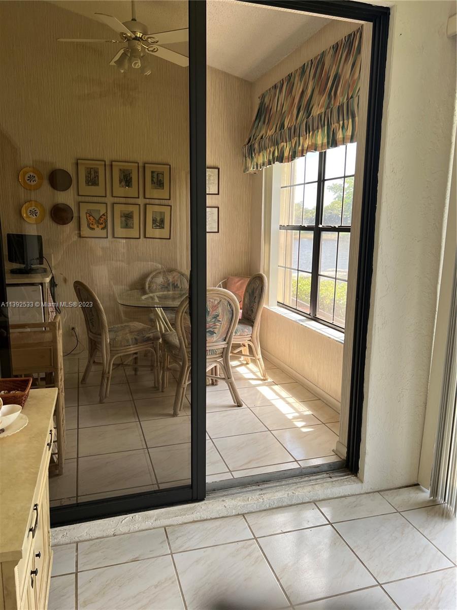 Aberdeen Boynton Beach, FL 33472 - Photo 9 of 19 a view of a livingroom with furniture and floor to ceiling window