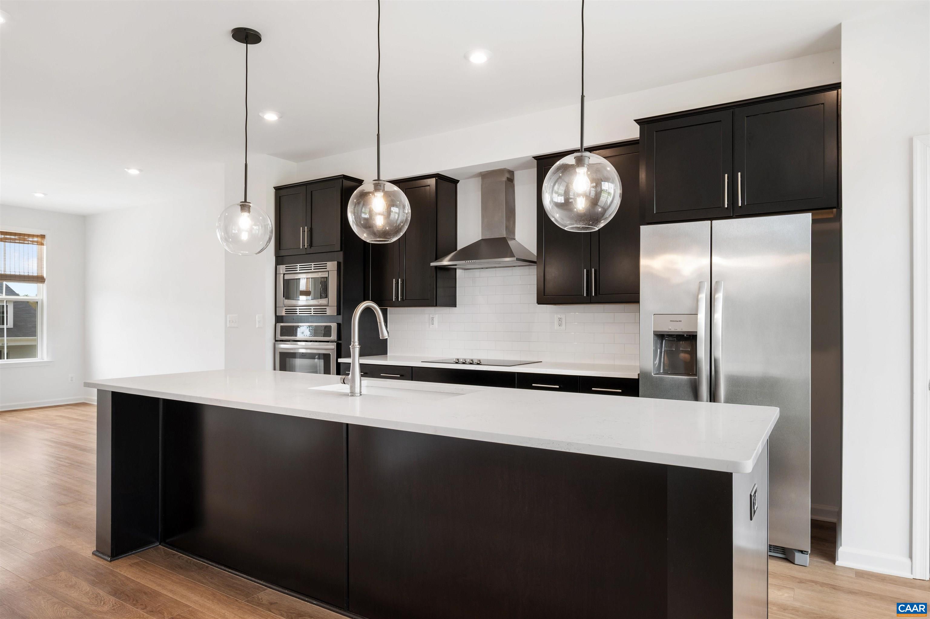 4454 Alston Street Crozet, VA 22932 - Photo 19 of 47 a kitchen with a counter space cabinets and stainless steel appliances
