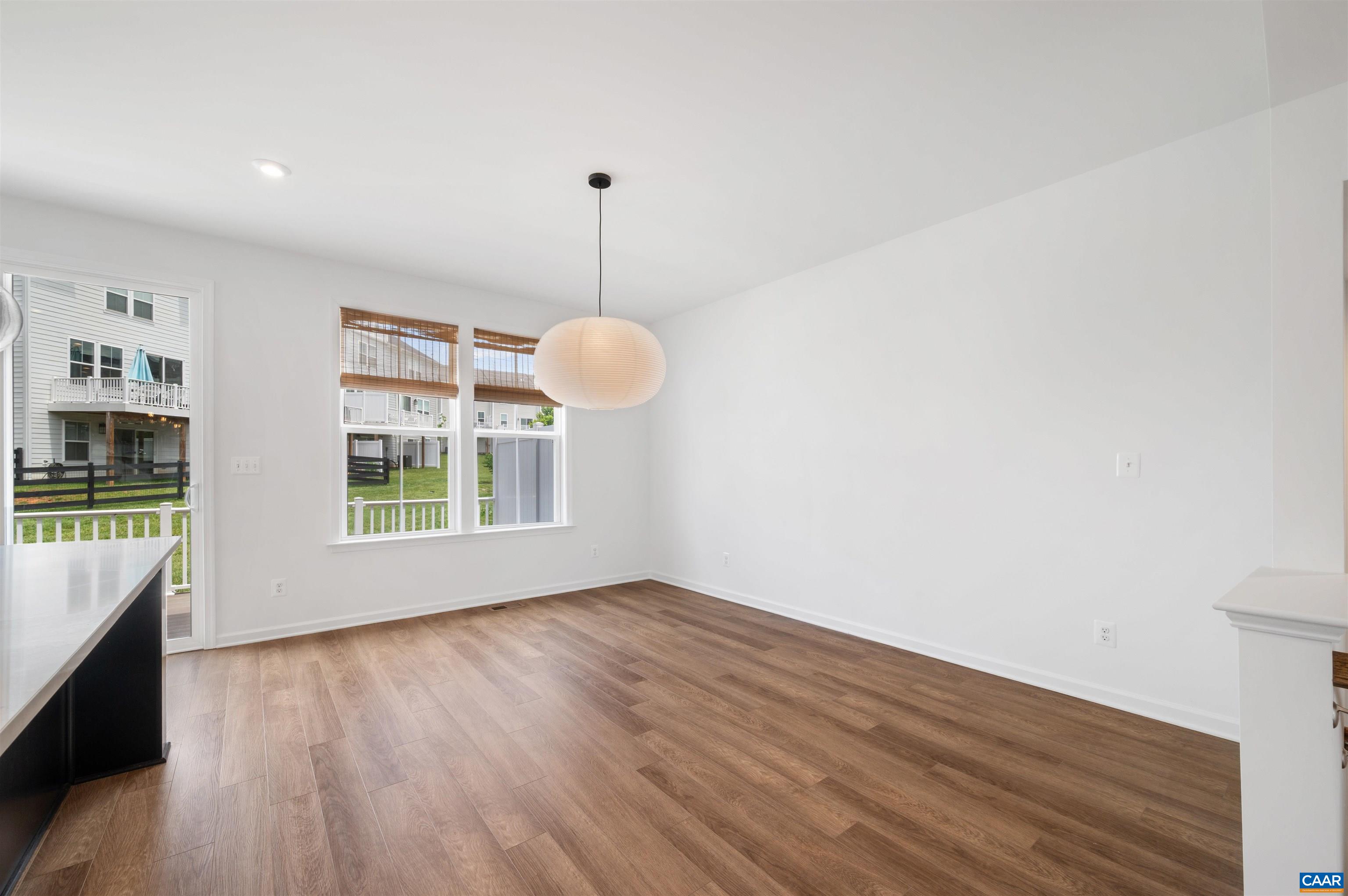 4454 Alston Street Crozet, VA 22932 - Photo 25 of 47 a view of an empty room with wooden floor and a window
