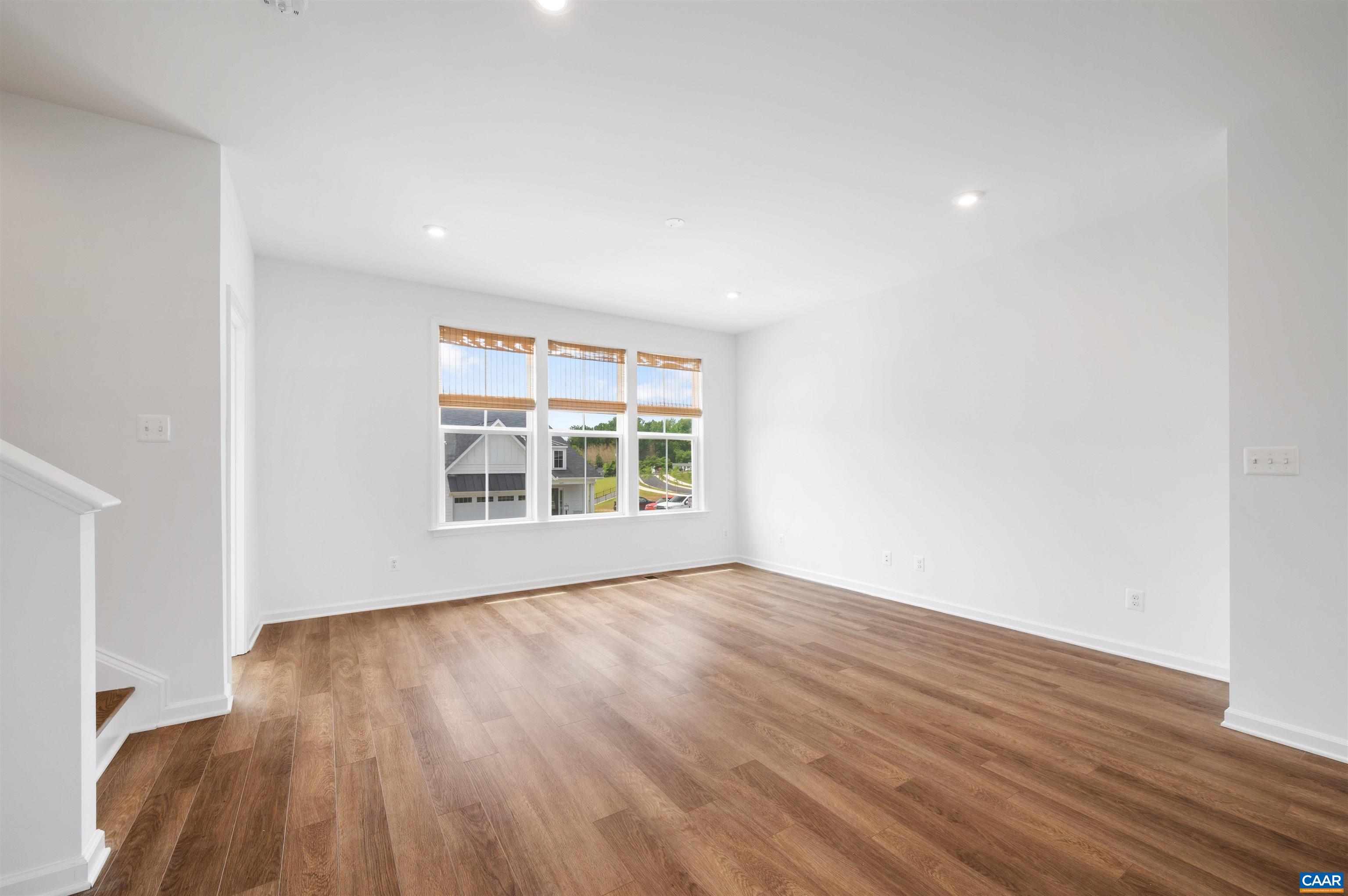4454 Alston Street Crozet, VA 22932 - Photo 27 of 47 a view of an empty room with wooden floor and a window