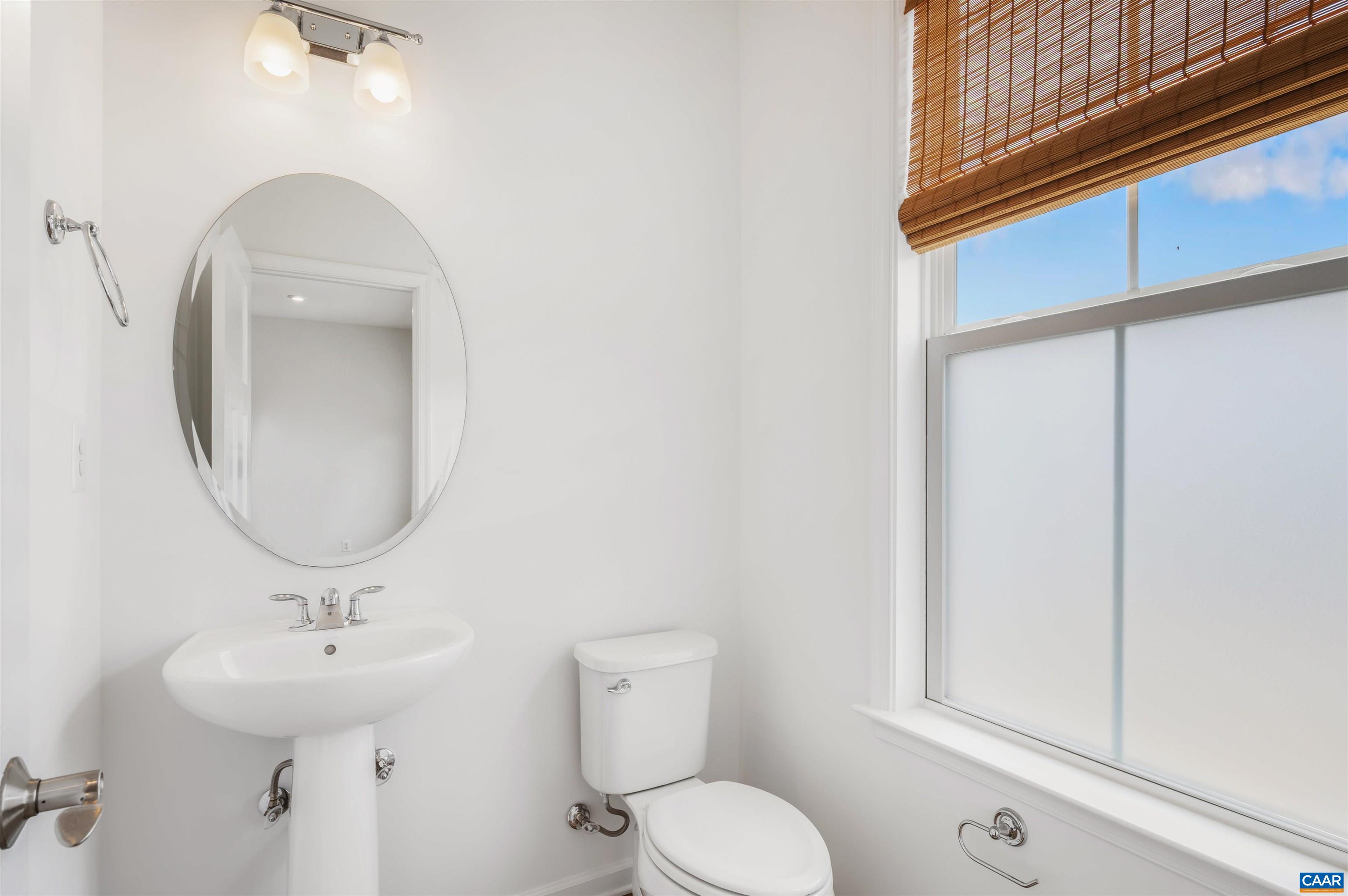 4454 Alston Street Crozet, VA 22932 - Photo 29 of 47 a bathroom with a toilet sink and mirror