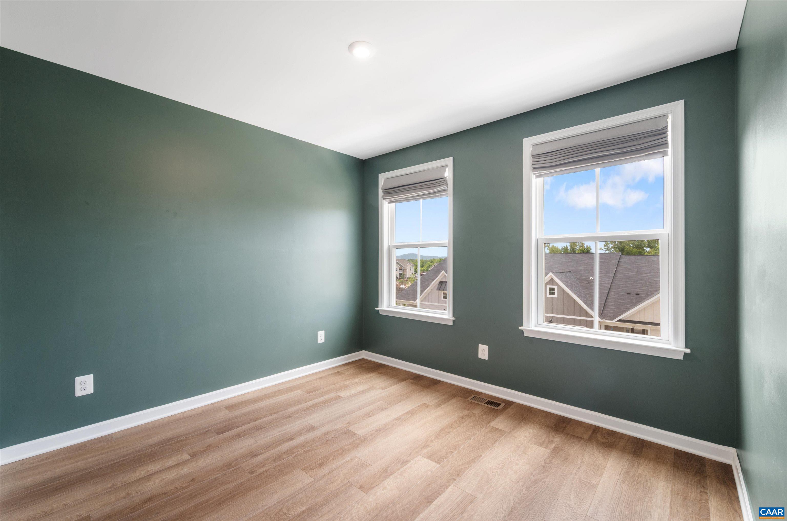4454 Alston Street Crozet, VA 22932 - Photo 39 of 47 an empty room with wooden floor and windows
