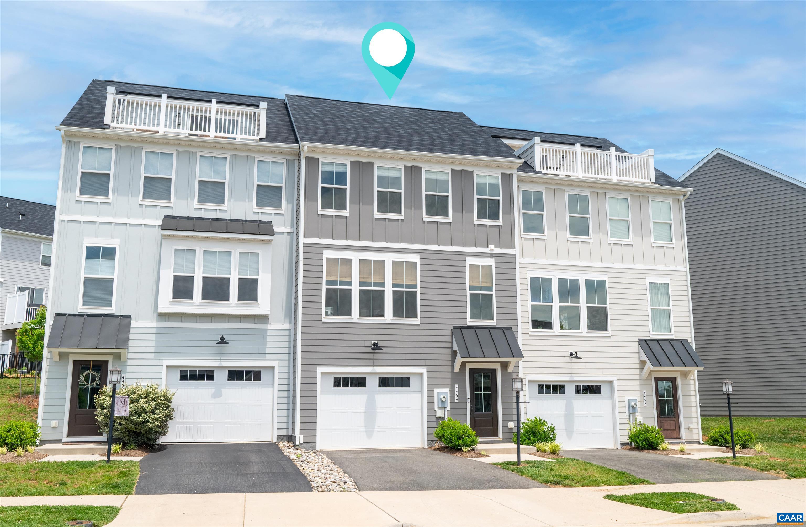 4454 Alston Street Crozet, VA 22932 - Photo 4 of 47 a front view of a building with a garden and plants