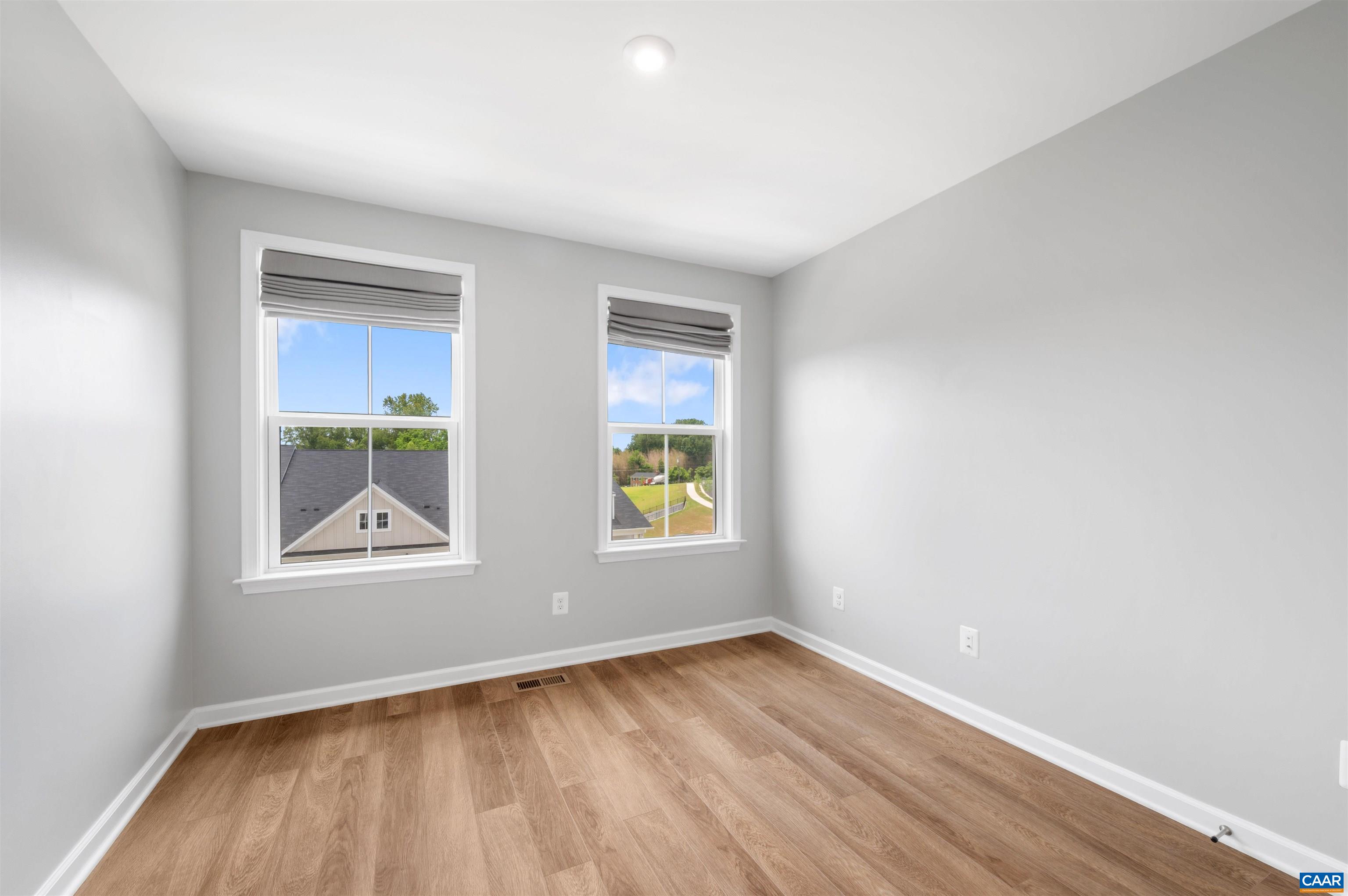 4454 Alston Street Crozet, VA 22932 - Photo 43 of 47 an empty room with wooden floor and windows
