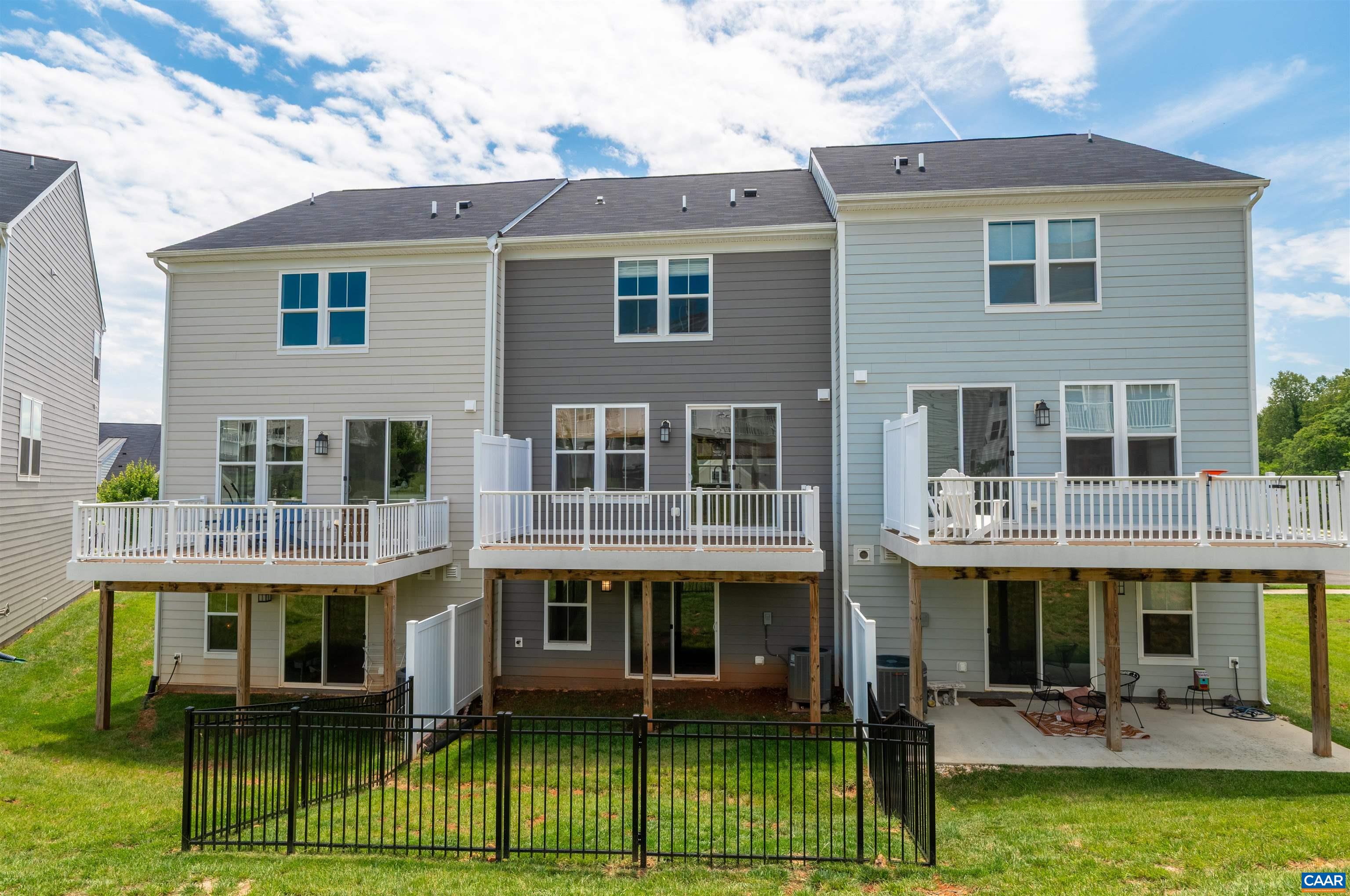 4454 Alston Street Crozet, VA 22932 - Photo 47 of 47 a front view of a house with a yard table and chairs