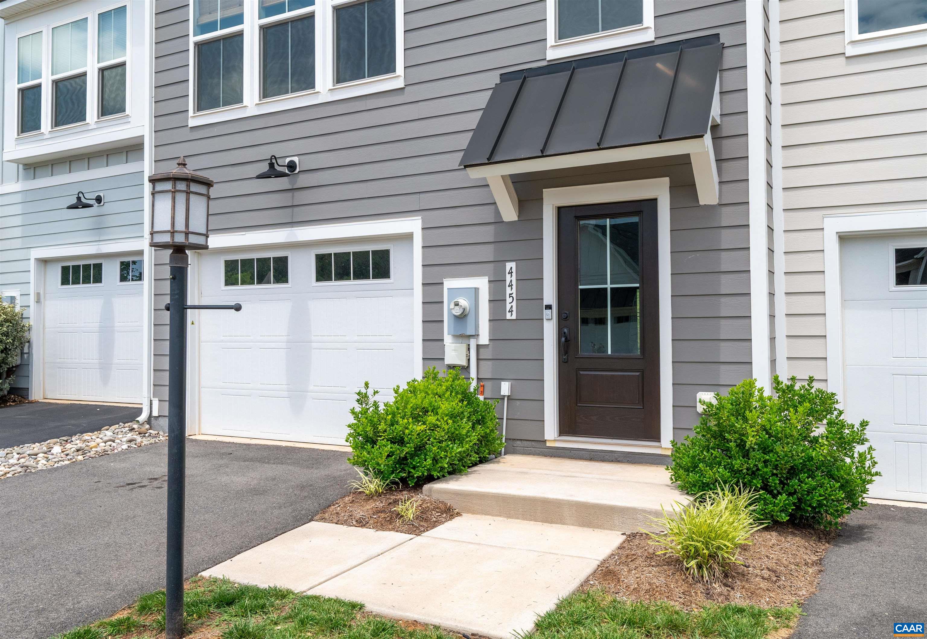 4454 Alston Street Crozet, VA 22932 - Photo 7 of 47 a front view of a house with a garden