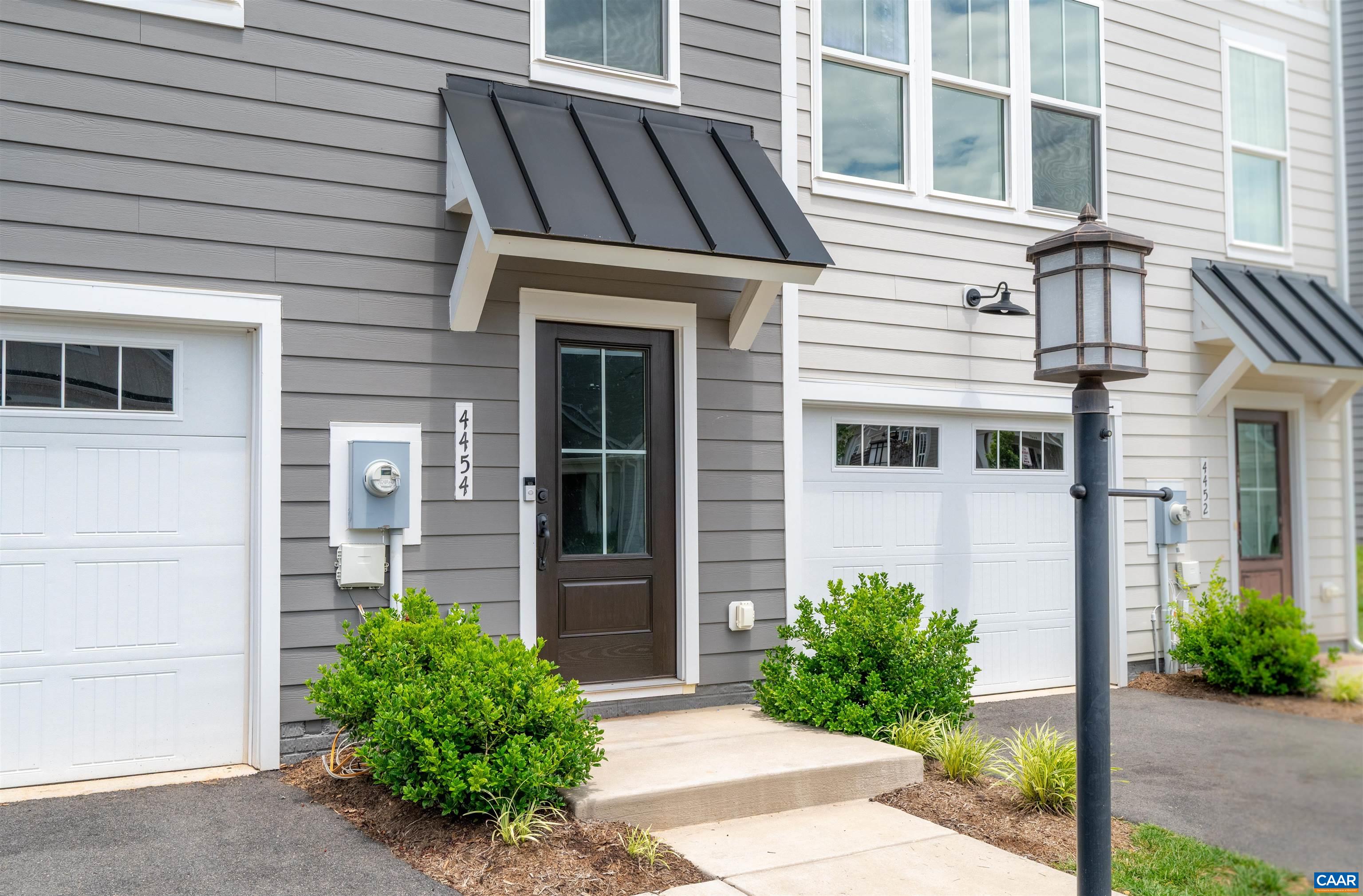 4454 Alston Street Crozet, VA 22932 - Photo 8 of 47 a front view of a house with garden