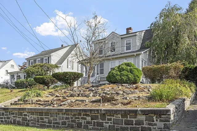 a view of a house with a yard and plants