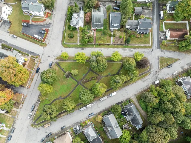 a view of a street with a building in the background