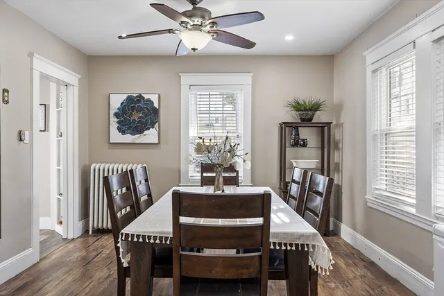 a dining room with furniture and window